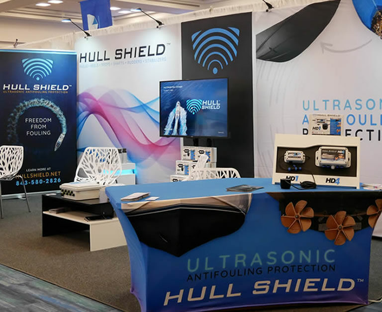 Image of Hull Shield's booth. Learn how ultrasonic antifouling can save your bottom paint.